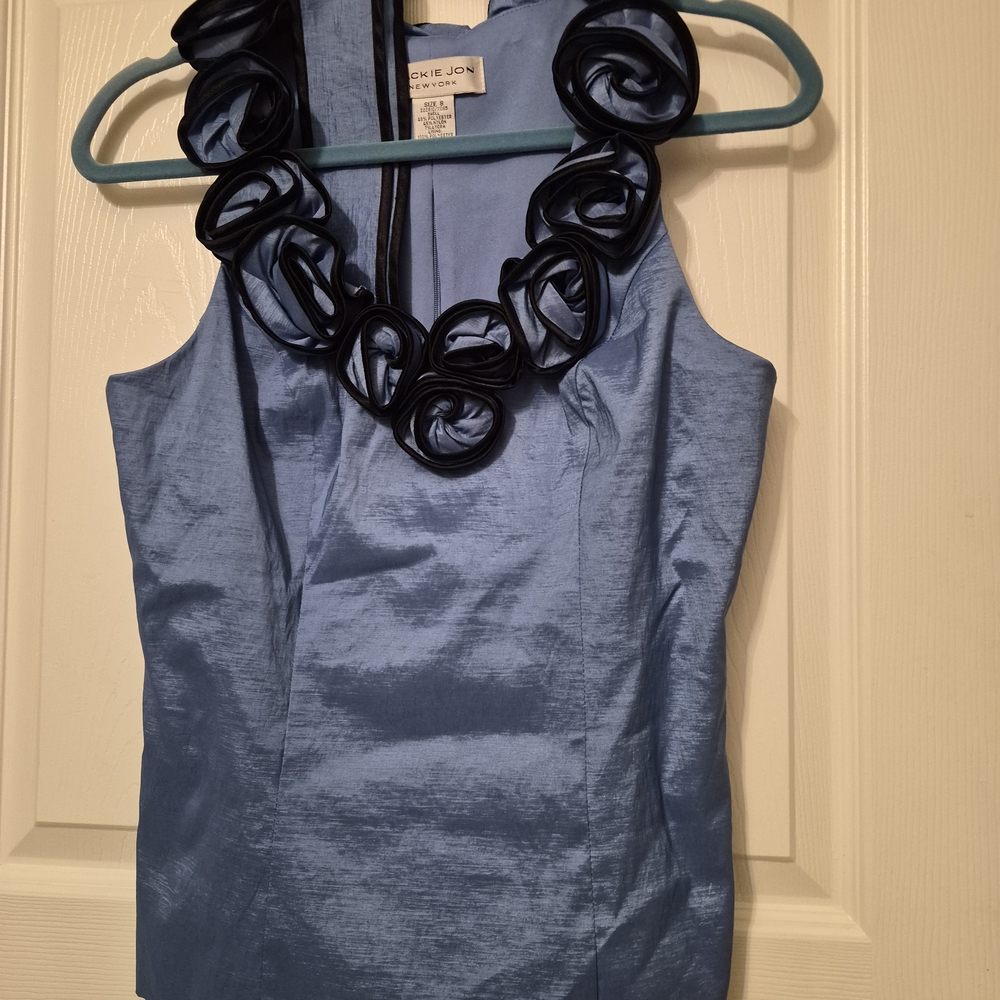 Chic Blue Sleeveless Blouse with Floral Accents